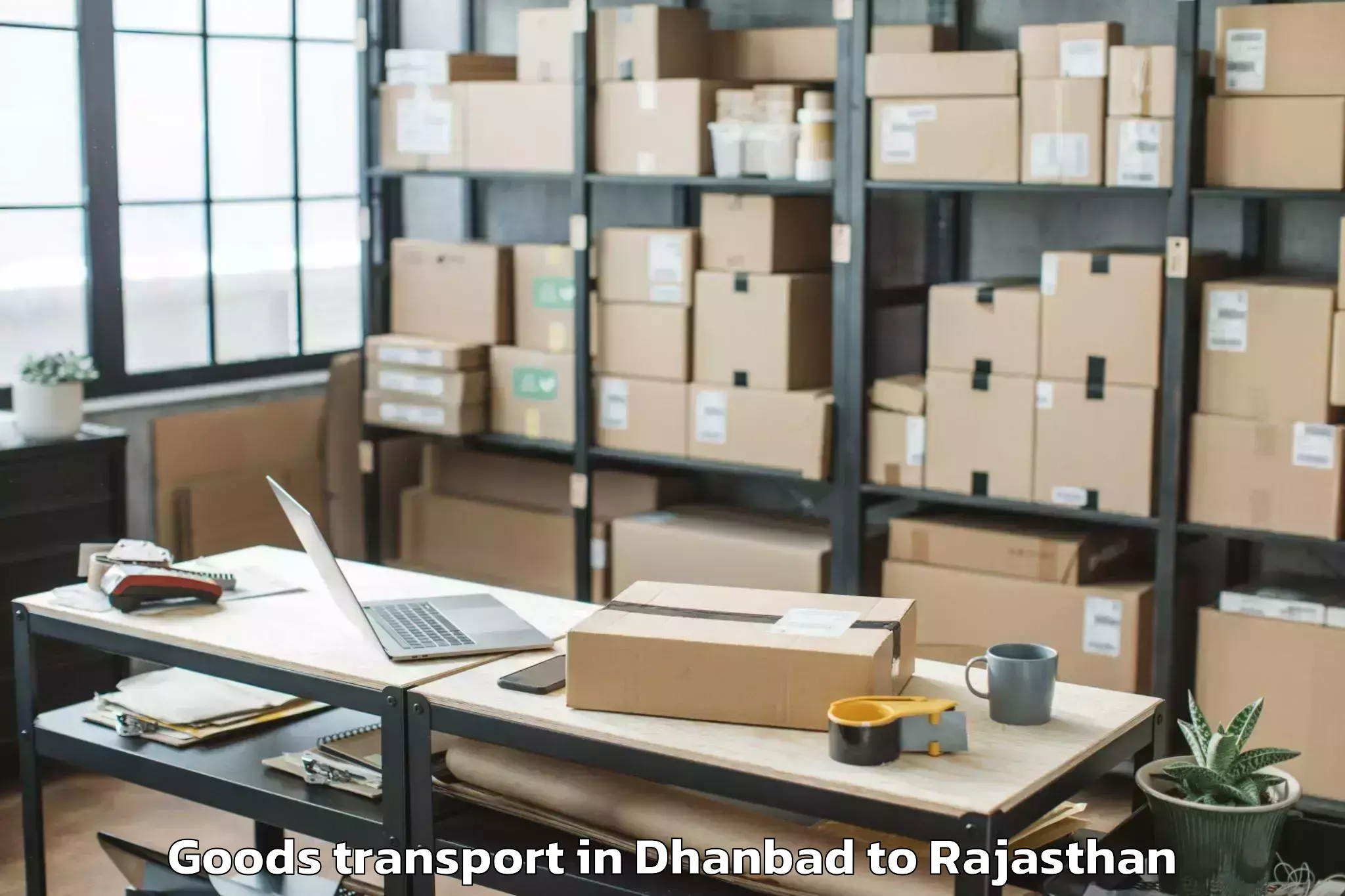 Book Dhanbad to Nadbai Goods Transport Online